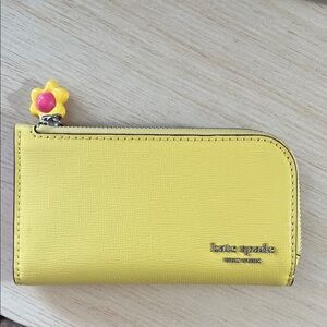 Kate Spade Devin Small Slim Bifold Wallet in yellow - excellent condition